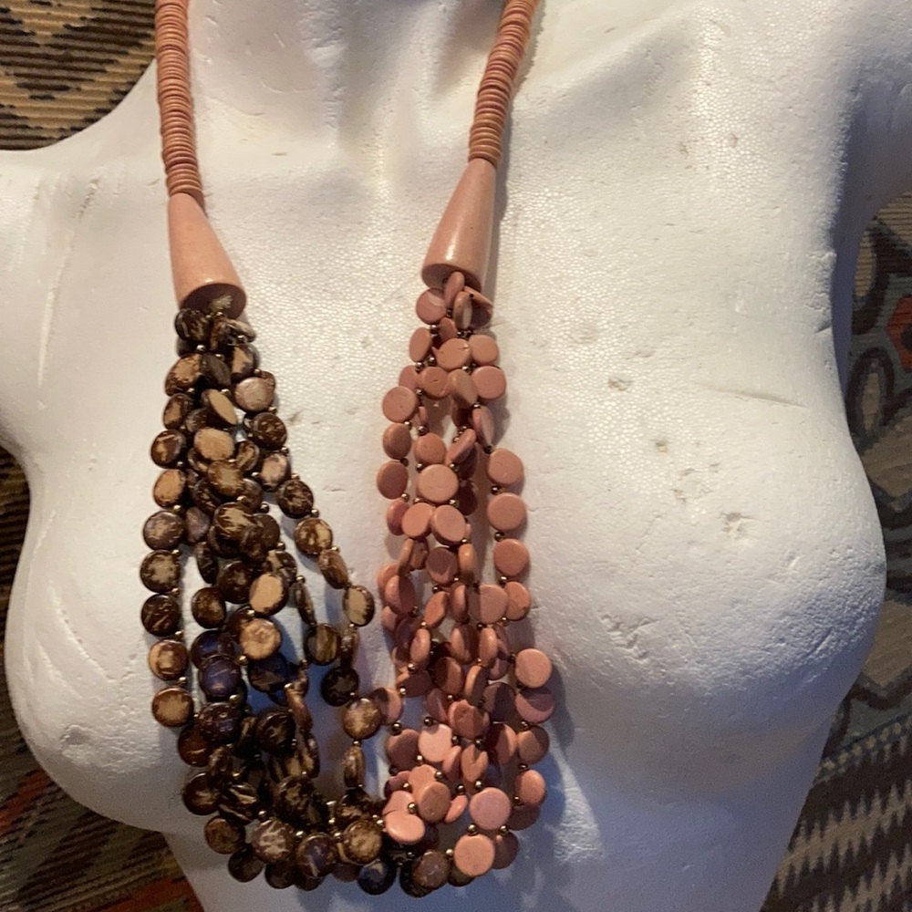 A necklace made of wooden beads, approx 29” long